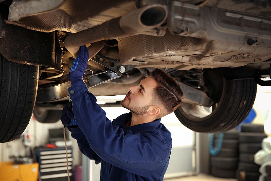Service employee working on car